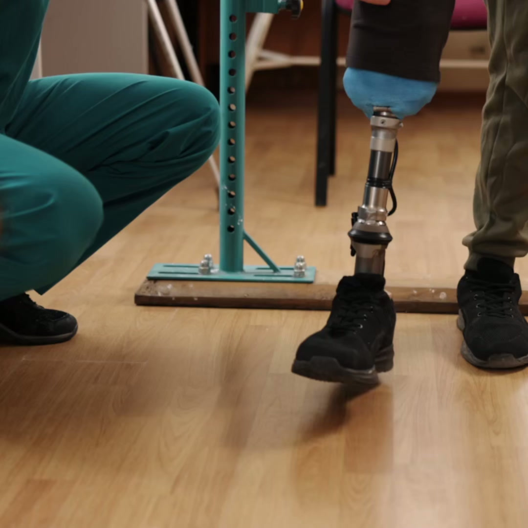 A veteran training with a prosthetic leg in rehabilitation